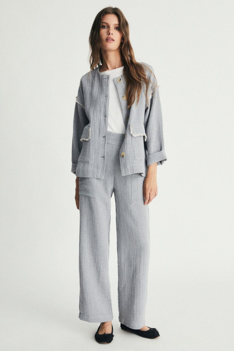 Pantalón bolsillos flecos